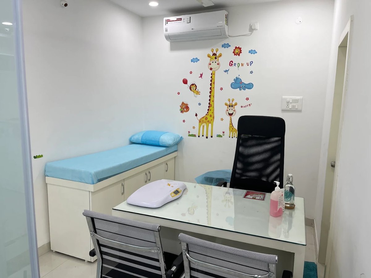 Paediatric examination room with baby weighing scale